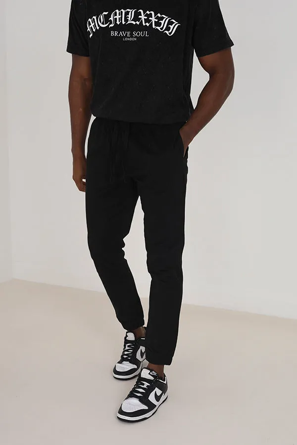 BLACK COTTON TWILL ELASTICATED CUFFED TROUSERS